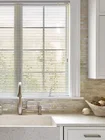 Aluminum Mini Blinds Aluminum blinds above the sink, providing a sleek, durable, and moisture-resistant window solution