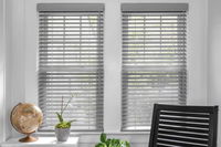 Wood blinds in Laredo Pewter finish feature a sleek and modern design that adds sophistication.