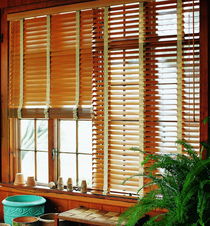 Real wooden blinds in a cozy room, showcasing natural wood texture and elegant light control.